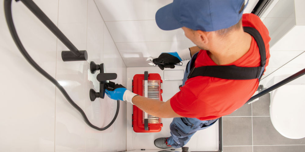 a man installing shower