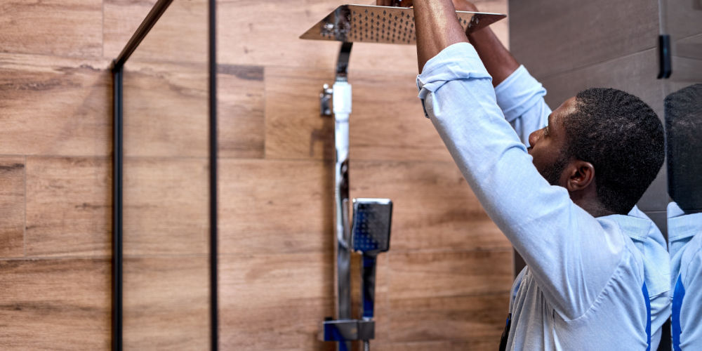 a man installing shower