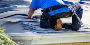 a man replacing a roof